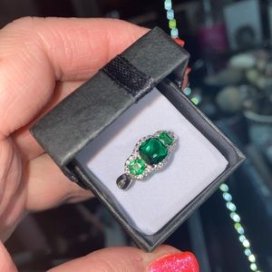 Cushion cut emerald with white sapphire ring